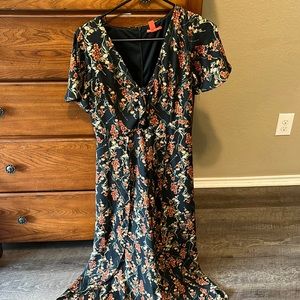 Jumpsuit with open legs and tie in front of chest